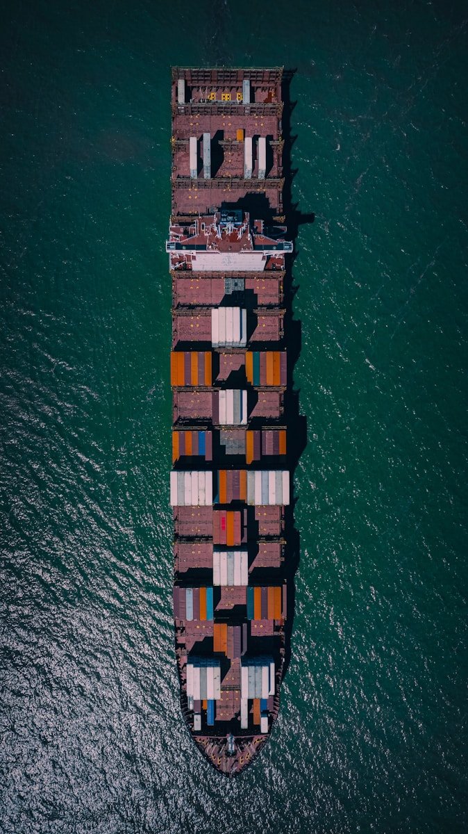a large cargo ship in the middle of the ocean